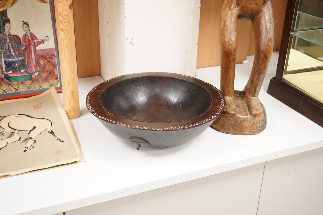 A Fijian carved wood Kava bowl and a West African Dogon fertility figure, 91cm tall